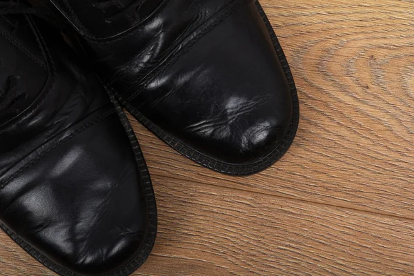 Shoes on a wooden floor — Stock Photo, Image