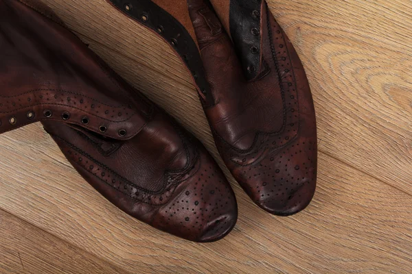 Shoes on a wooden floor — Stock Photo, Image