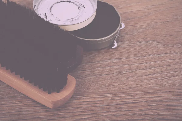 stock image Shoe polishig equipment on a wooden floor Vintage Retro Filter.