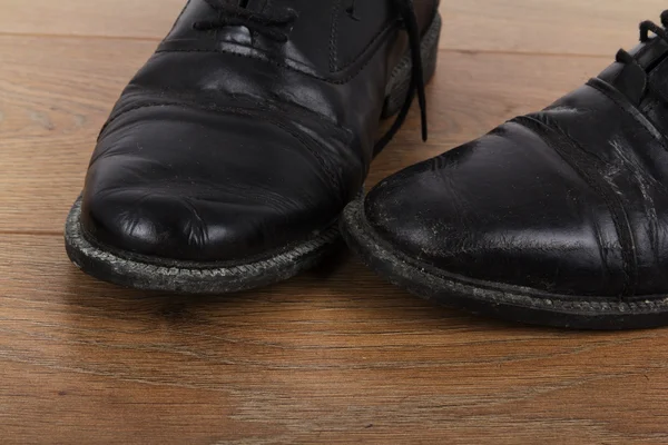 Shoes on a wooden floor — Stock Photo, Image