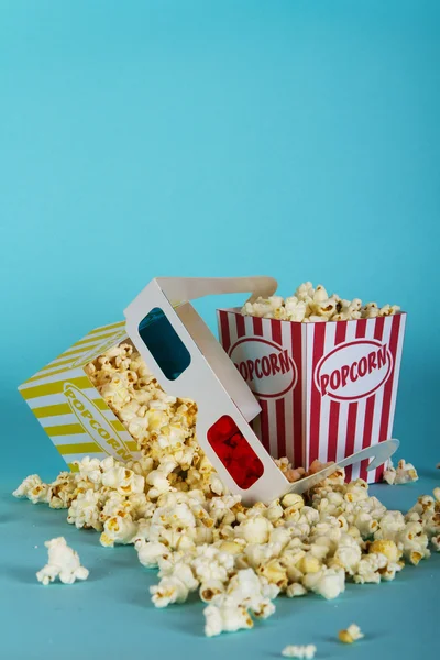 Popcorn bucket against a blue background