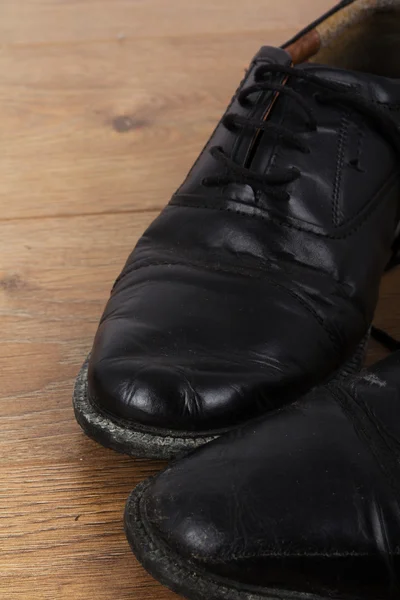 Shoes on a wooden floor — Stock Photo, Image