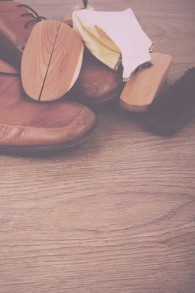 Shoes and cleaning equipment on a wooden floor Vintage Retro Fil