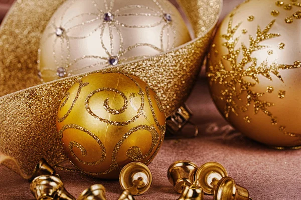 Festive gold Christmas decorations on fabric background HDR Filt — Stock Photo, Image