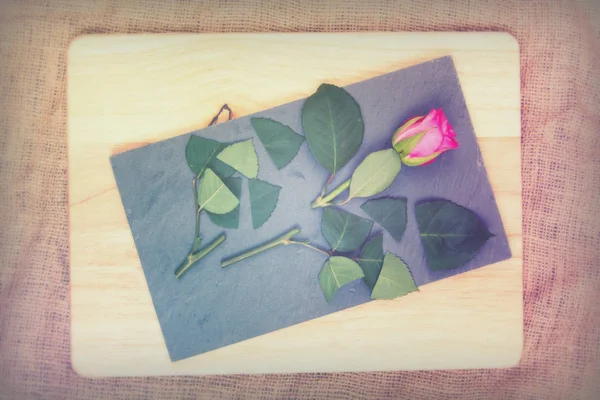 Rose cut up on piece of slate