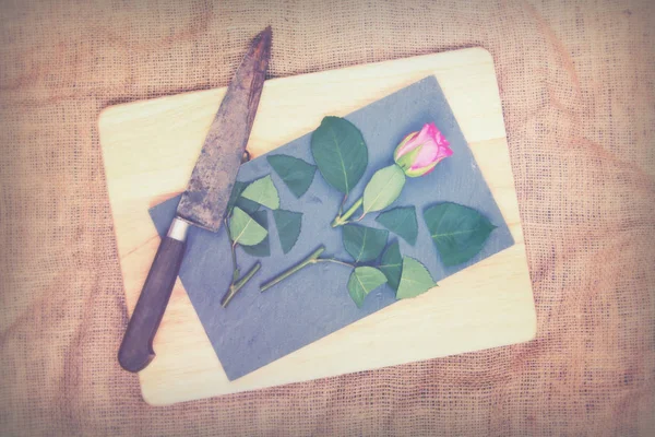 Rose cut up on piece of slate