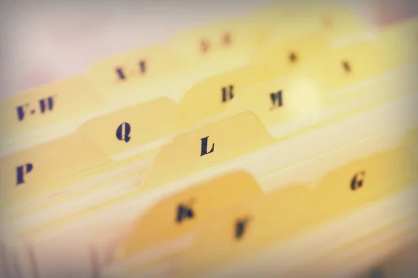 Close up of alphabetical index cards in box