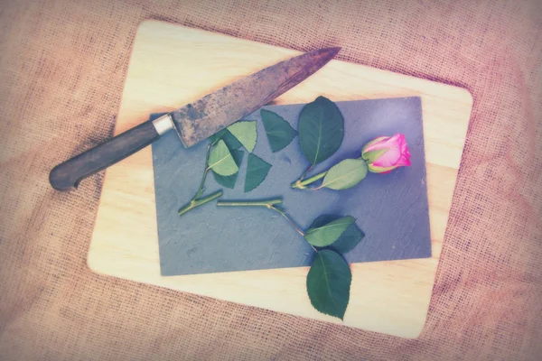 Rose cut up on piece of slate