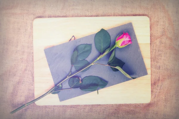 Rose cut up on piece of slate