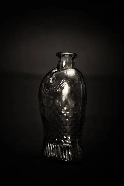 Old colourful bottles against a dark background — Stock Photo, Image