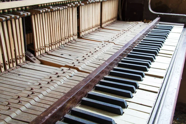 Keys from an old broken damaged piano