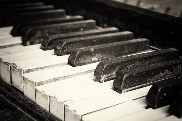 Keys from an old broken damaged piano