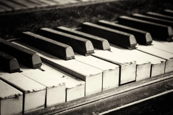 Keys from an old broken damaged piano