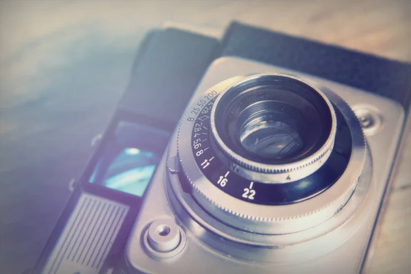 Old vintage retro camera on wooden background — Stock Photo, Image