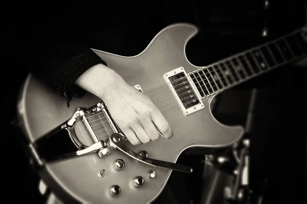 Close up of man playing a guitar — Stock Photo, Image