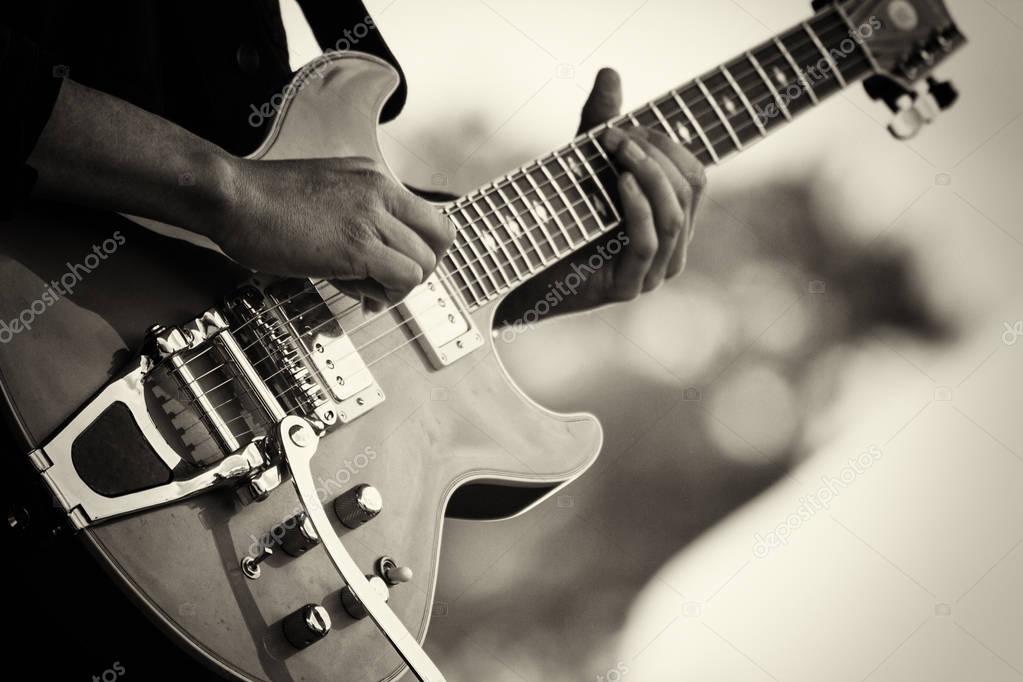 Close up of man playing a guitar