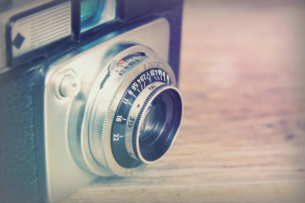 Old vintage retro camera on wooden background — Stock Photo, Image