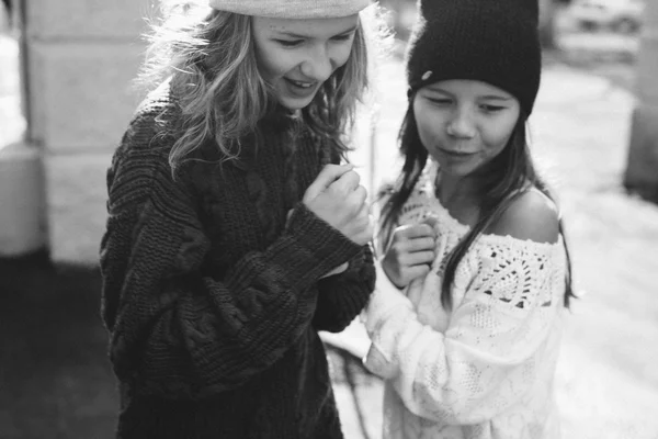 Two girls playing in the street together Royalty Free Stock Photos