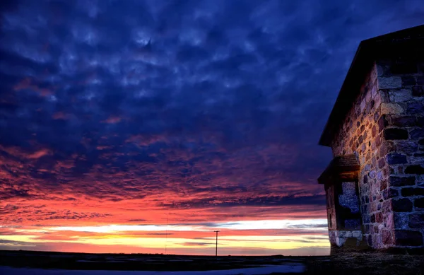Casa de piedra puesta de sol — Foto de Stock