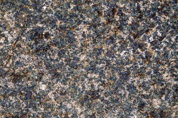 Hintergrund der Oberfläche des geschliffenen Steins. behandelte Oberfläche aus Granit. — Stockfoto