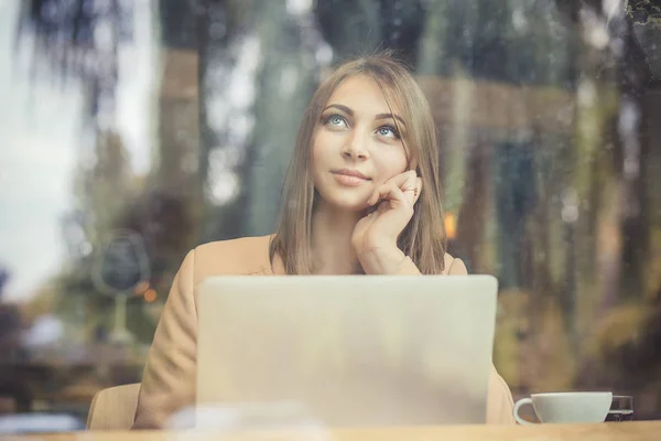 Thinking. Beautiful business woman with computer daydreaming, thinking about future plans — Stock Photo, Image