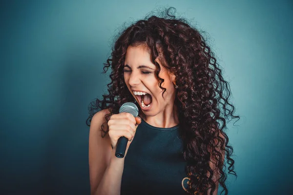 Business woman screaming / talking screaming in microphone.