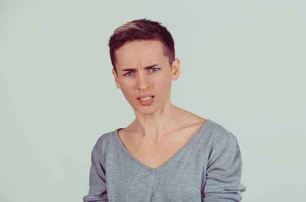 Closeup portrait young serious angry grumpy woman isolated on gr — Stock Photo, Image