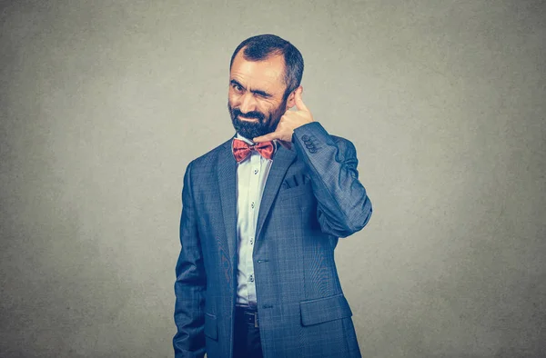 Handsome worker making showing call me gesture sign with hand shaped like phone — ストック写真