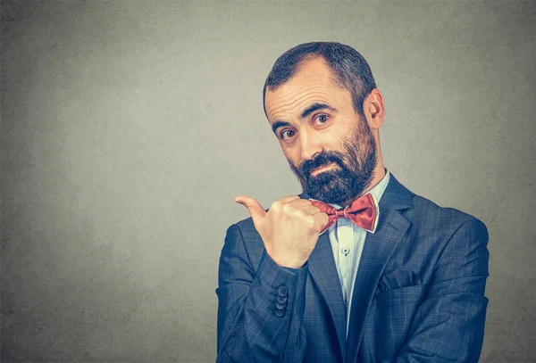 Businessman shows the direction pointing finger to side — Stock Photo, Image