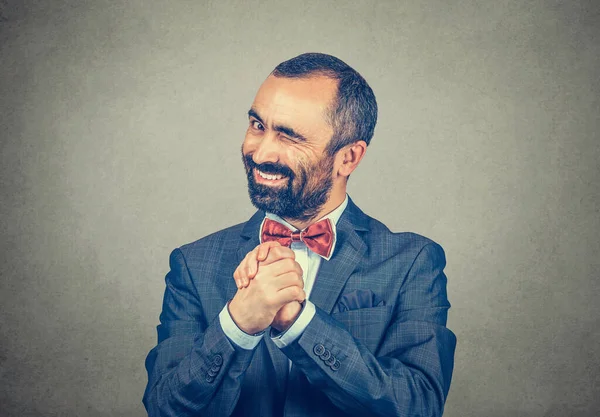 Kind Mature Businessman Showing Clasped Hands Pretty Please Winking Left — Stock Photo, Image