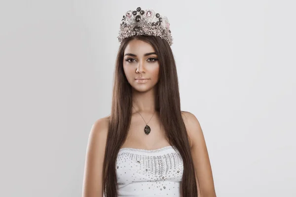 Dark beauty. Closeup portrait african american indian mixed race woman slightly smiling looking at you camera on white grey background. Crowned beauty queen miss contestant bride to be fashion model — ストック写真