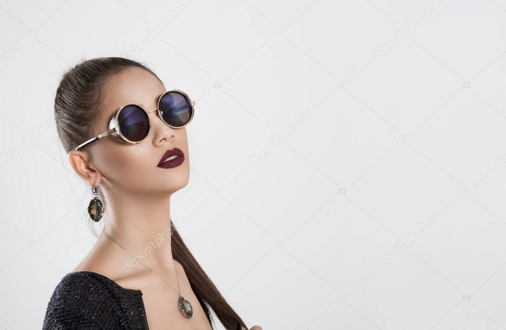 I am sexy and I know it. Closeup portrait confident successful beautiful young woman fashion girl posing with sunglasses eye glasses looking at you camera serious isolated white grey background wall 