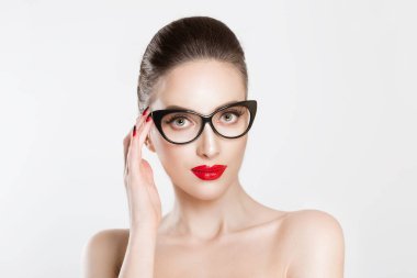 Vision. Closeup attractive fashion sexy girl wearing eye glasses woman holding her pair of glasses isolated white light grey background wall