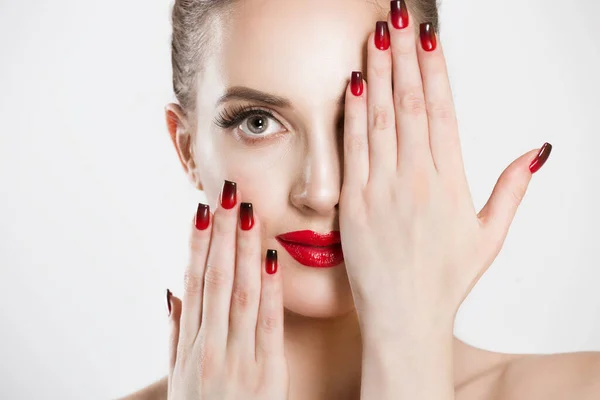 Sexy Beauty Girl with false eyelashes Black Red gradient Lips, Nails. Provocative natural Make up. Luxury Woman looking at you camera hands on face Fashion Brunette Portrait isolated white background — Stockfoto