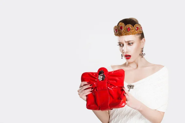 The princess looked into the red bag and was surprised to forget — 스톡 사진