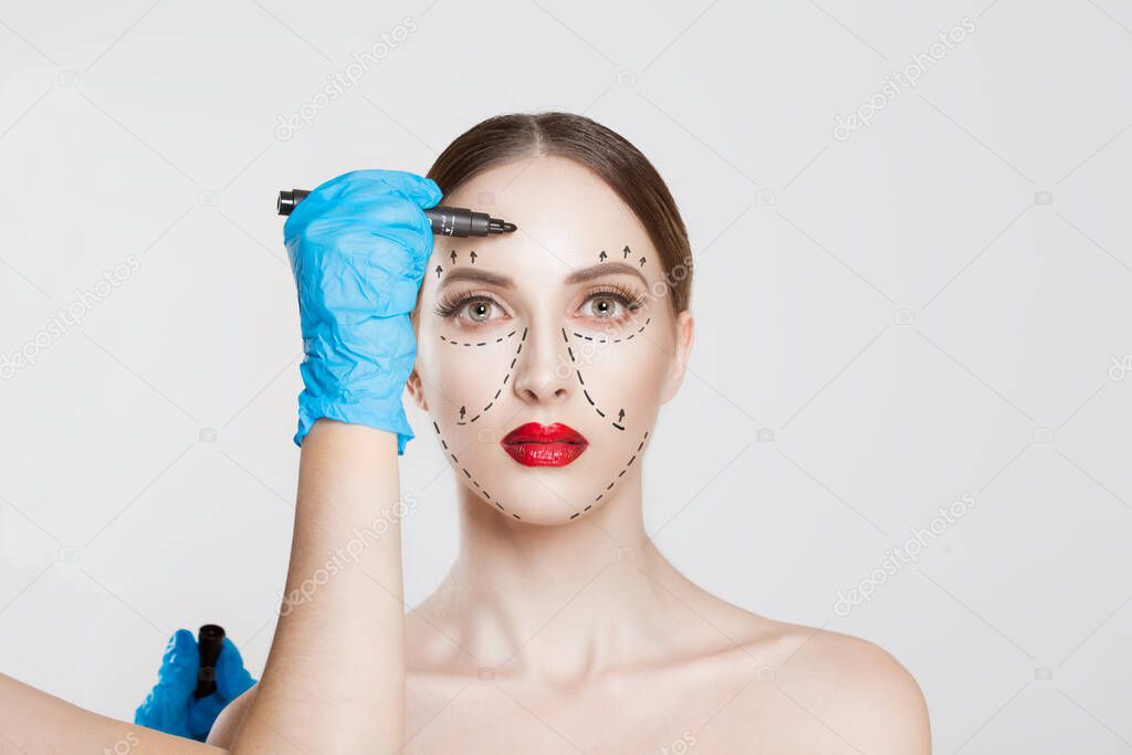 Facial cosmetic plastic surgery. Doctor surgeon hand in glove dr
