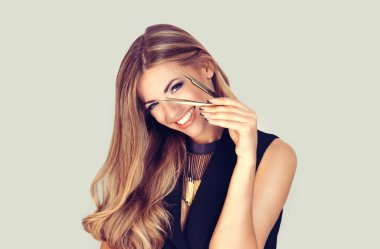 beautiful girl woman holding tools for eyebrows eyelashes extensions