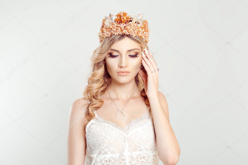 Beauty crowned queen girl woman actress miss looking down eyes closed isolated white grey background wall