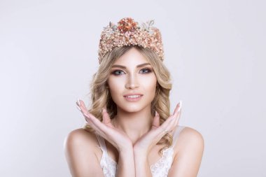 Beauty bride with pastel colors makeup silver crown looking at y