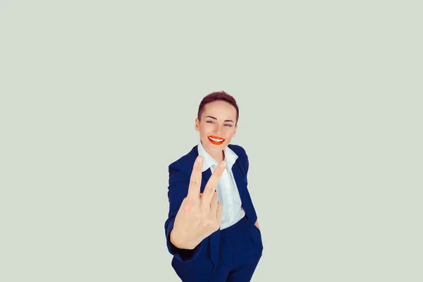 Beautiful Woman Giving Victory Sign Over A light green White Background — 스톡 사진