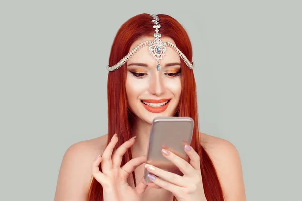 Good news by phone. Happy woman toothy smile looking at mobile phone texting receiving pleasant message looking at beautiful photos in social media — Stock Photo, Image