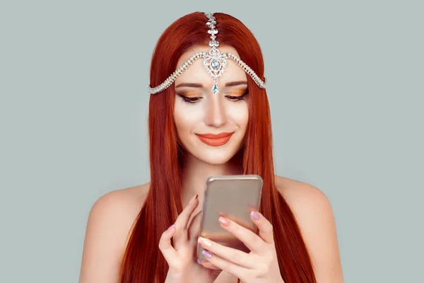 Good news by phone. Happy woman smiling looking at mobile phone texting receiving pleasant message looking at photos in social media — Stock Photo, Image