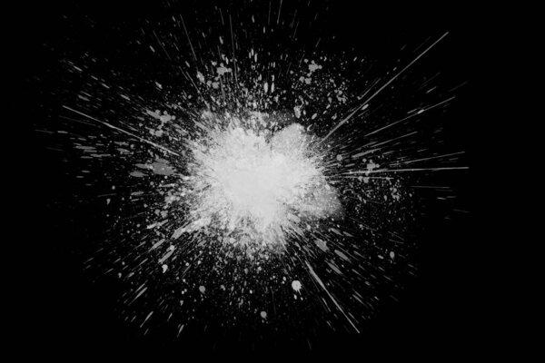 Freeze motion of white powder exploding, isolated on black, dark background. Abstract design of white dust cloud. Particles explosion screen saver, wallpaper with copy space. Planet creation concept