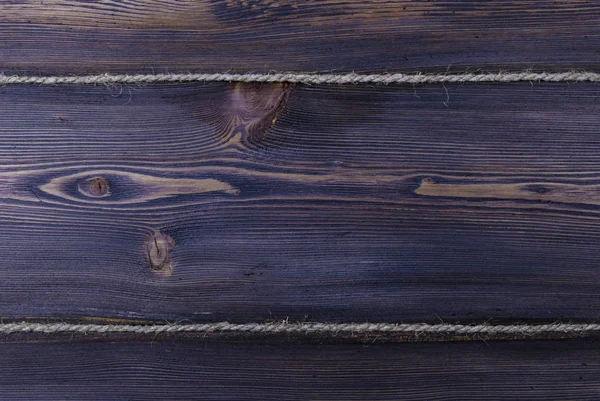 Textura de fondo de madera oscura con cuerda vieja — Foto de Stock
