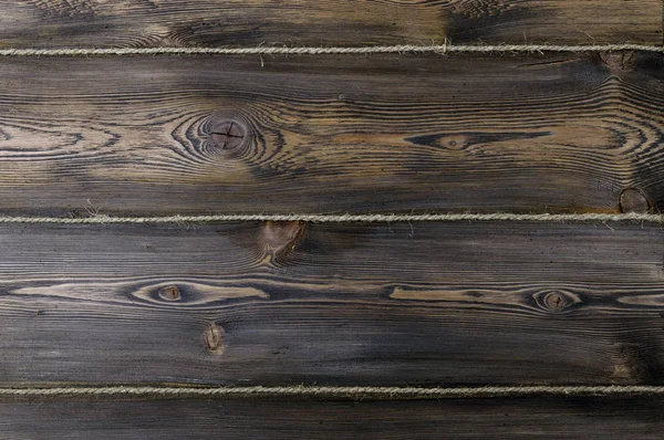 Textura de fondo de madera oscura con cuerda vieja — Foto de Stock