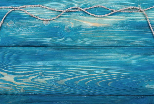 Μπλε φόντο ξύλινη υφή με παλιά σχοινί — Φωτογραφία Αρχείου
