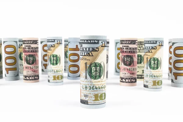 Dollar. Dollar banknotes roll in other positions. American US currency on white board. American dollar banknote rolls in all denominations on white background — Stock Photo, Image