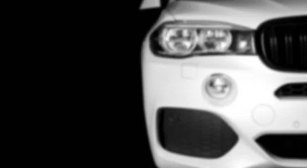 Blurred background with modern luxury white car. Внешние детали автомобиля. Мягкая молния — стоковое фото