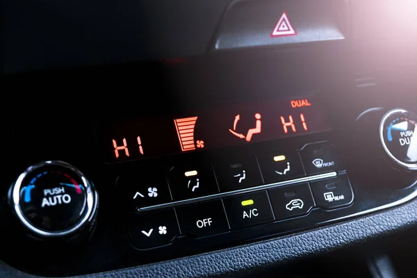 Air conditioning button inside a car. Climate control AC unit in the new car. Modern car interior details