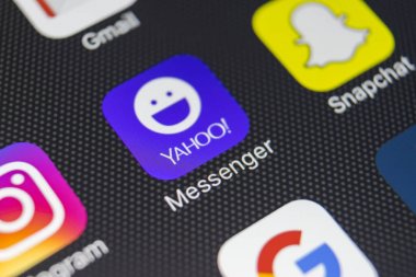 Yahoo messenger application icon on Apple iPhone 8 smartphone screen close-up. Yahoo messenger app icon.  clipart